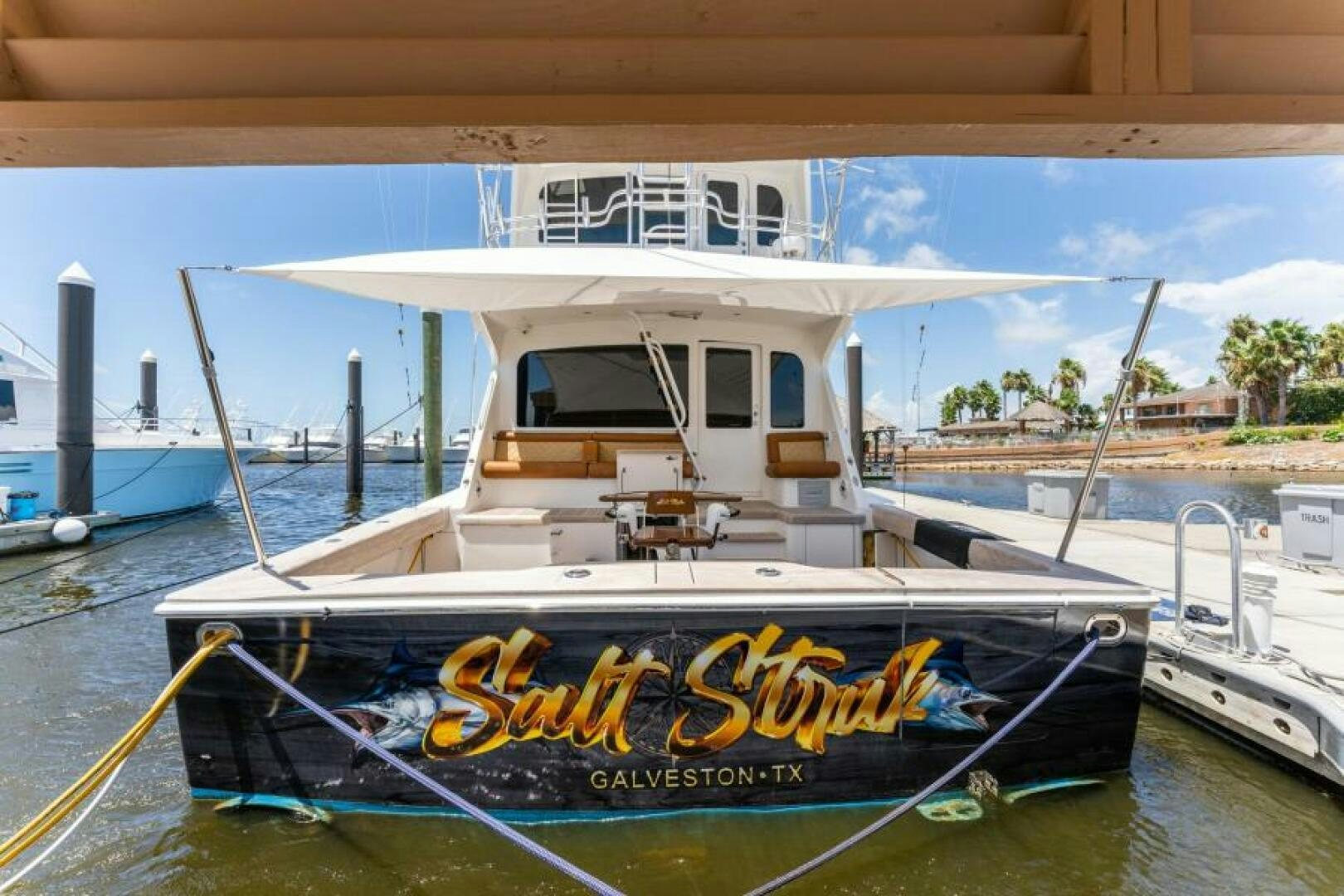 a boat tied to a dock aboard SALT STRUK Yacht for Sale