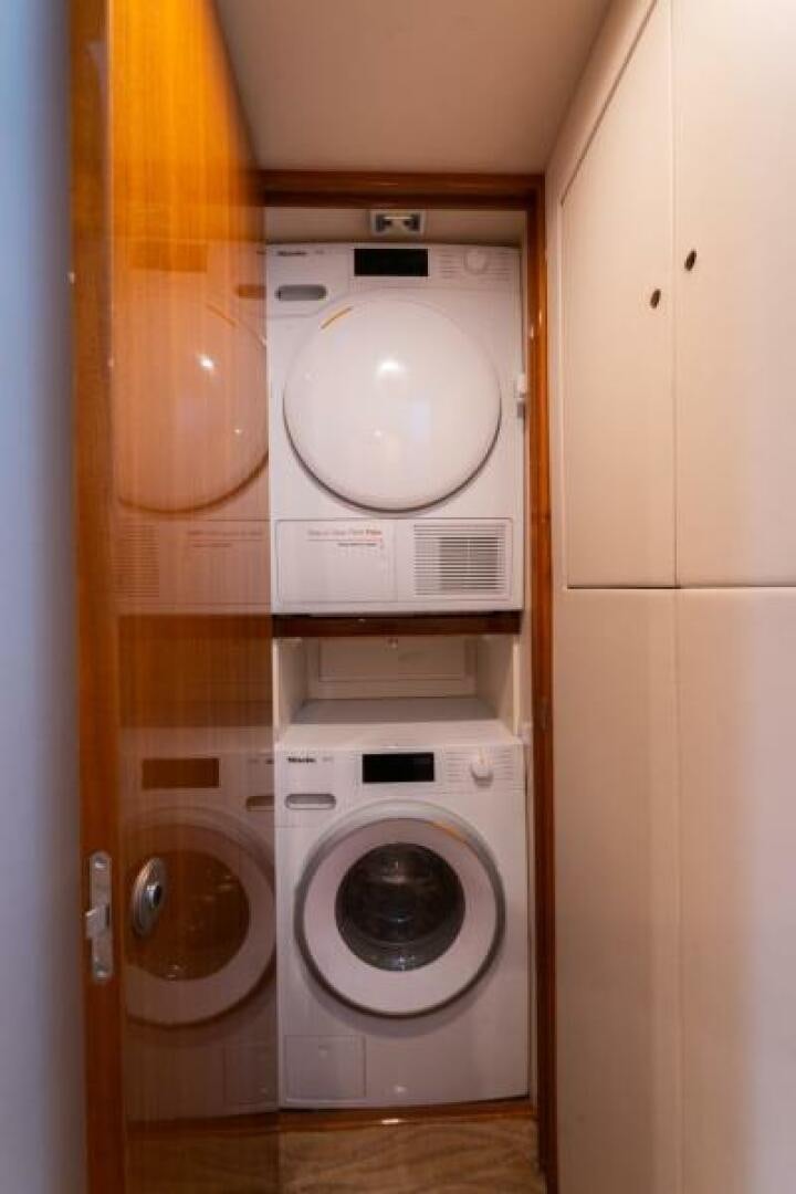 a washer and dryer in a closet aboard SALT STRUK Yacht for Sale