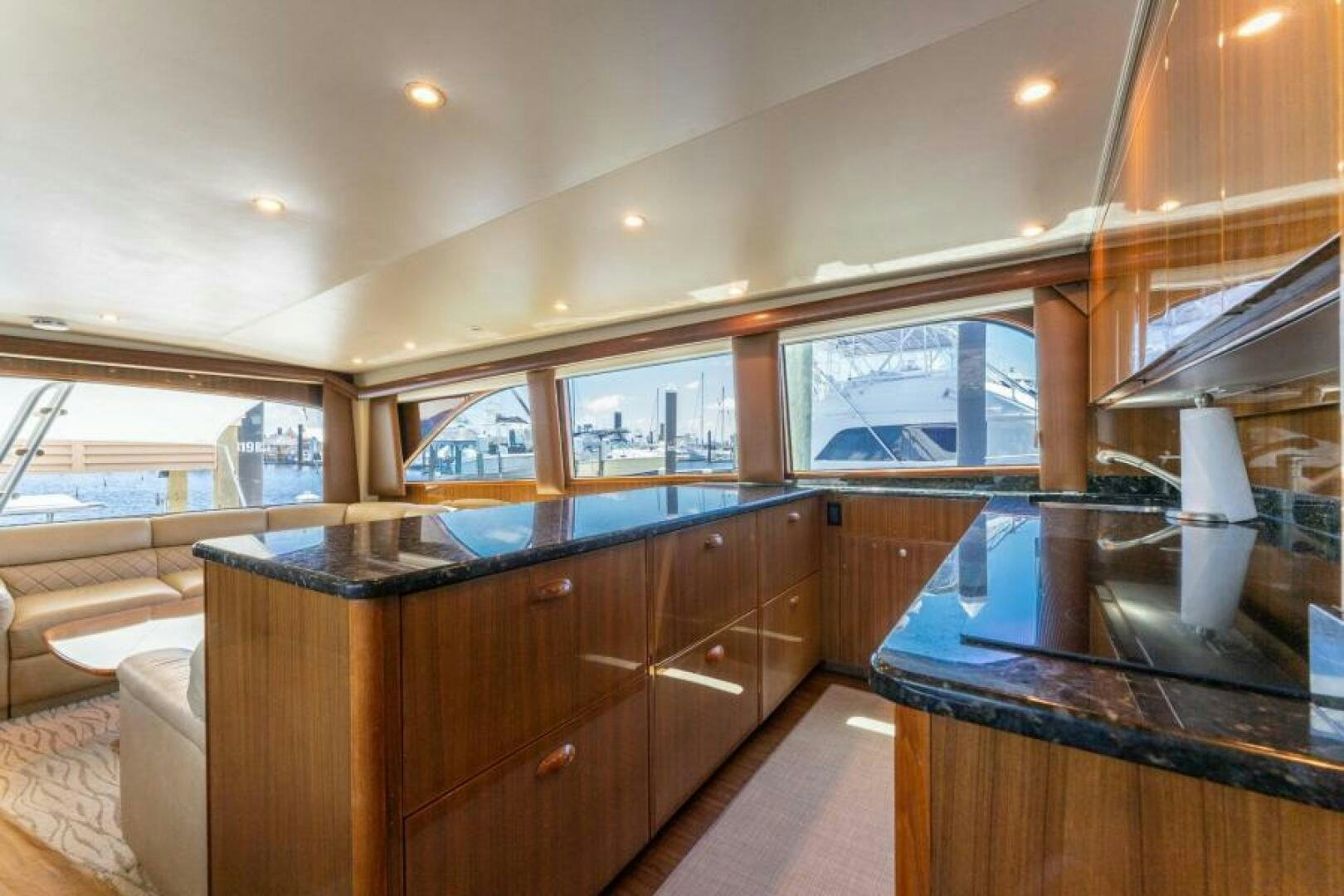 a kitchen with wooden cabinets aboard SALT STRUK Yacht for Sale