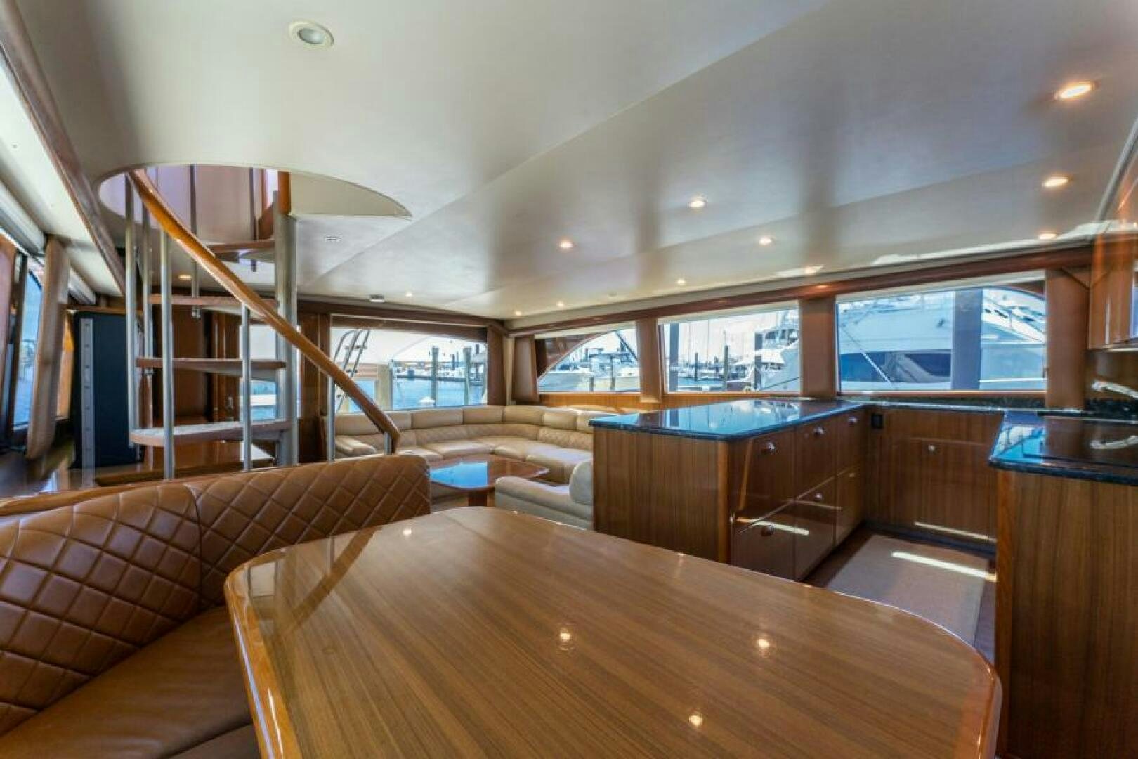 a room with a table and couches aboard SALT STRUK Yacht for Sale