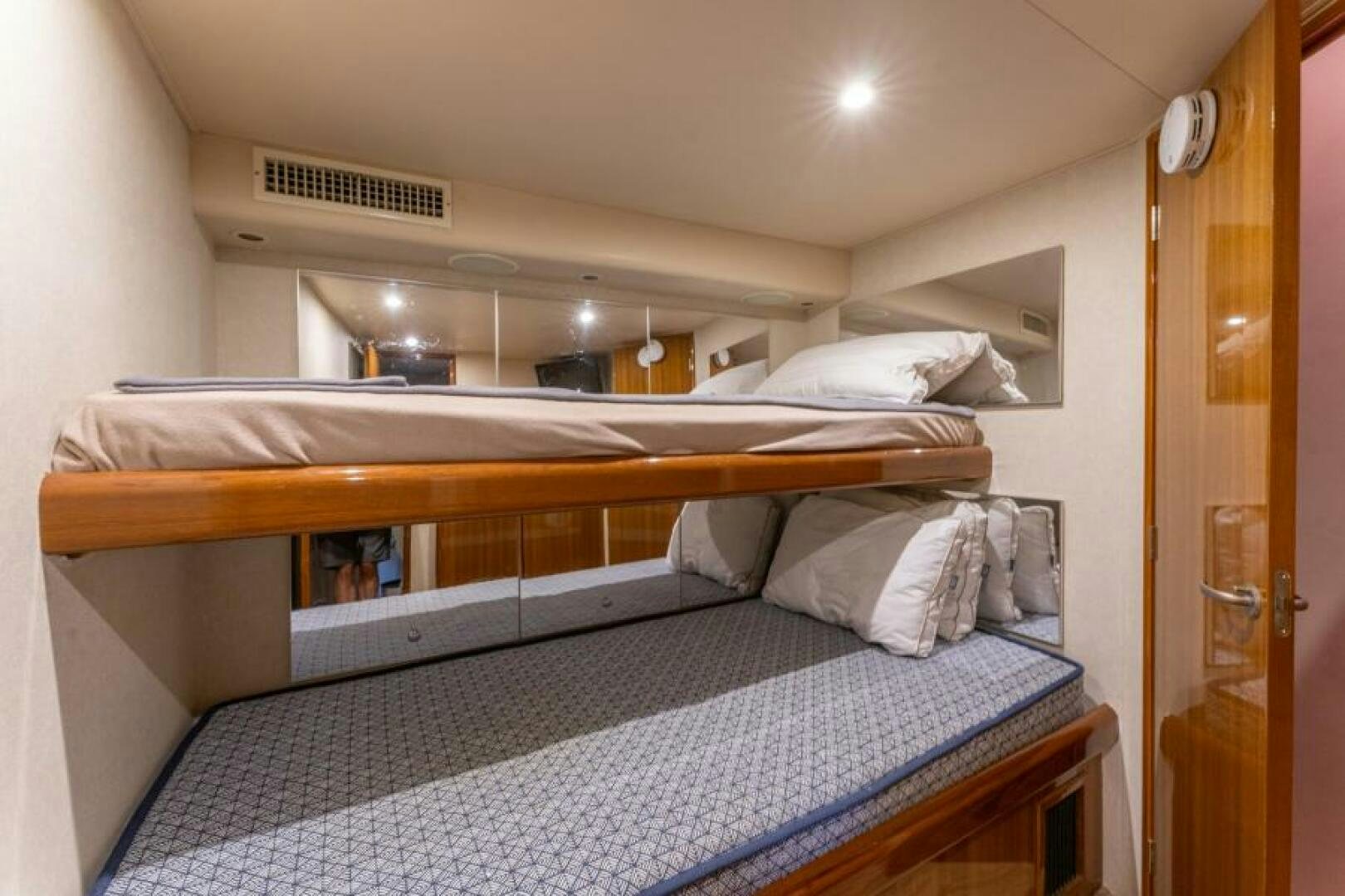 a room with bunk beds aboard SALT STRUK Yacht for Sale