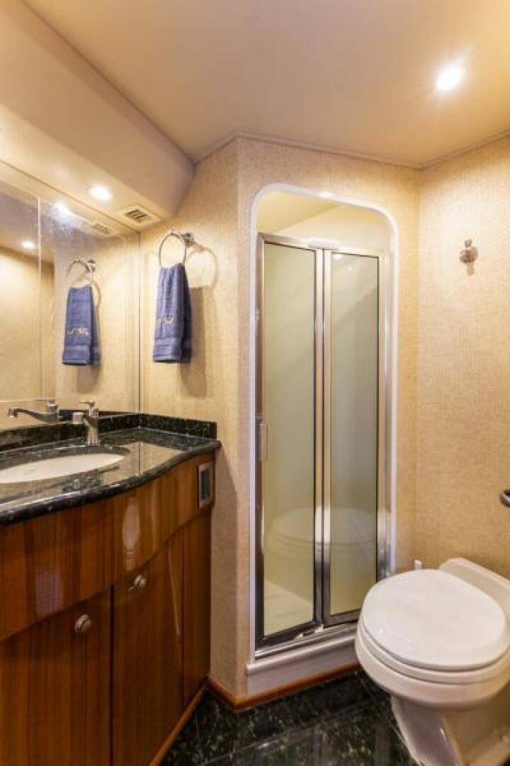 a bathroom with a glass shower aboard SALT STRUK Yacht for Sale