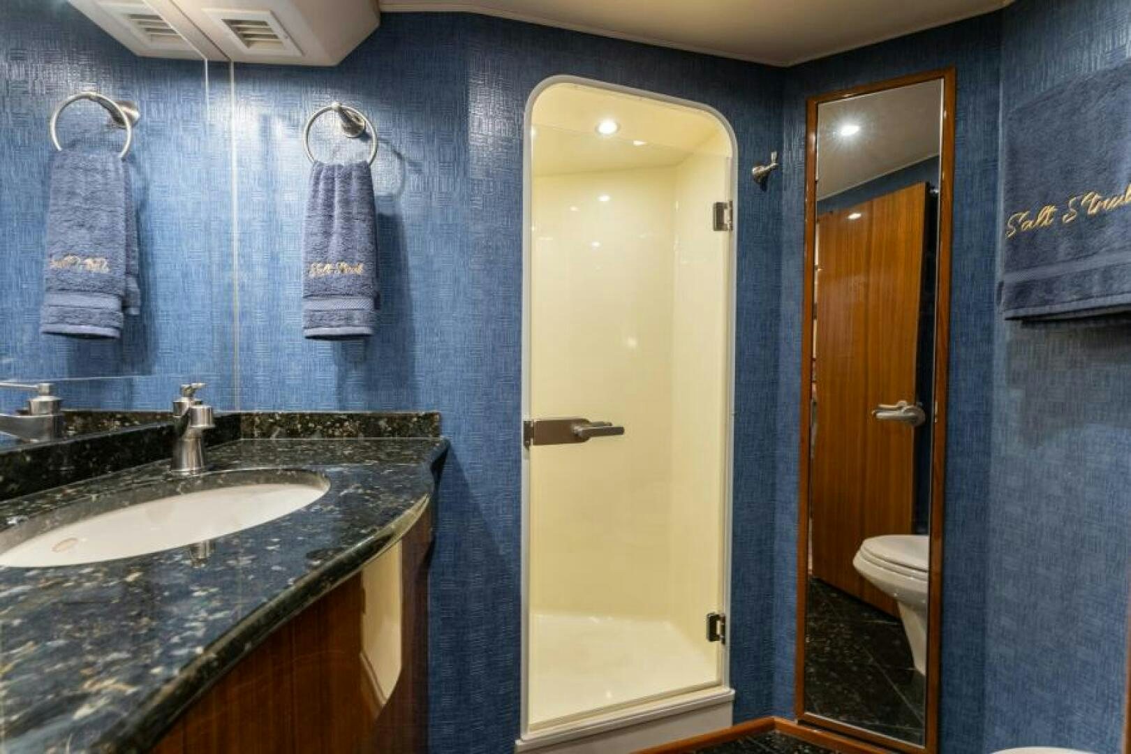 a bathroom with a sink and a shower aboard SALT STRUK Yacht for Sale