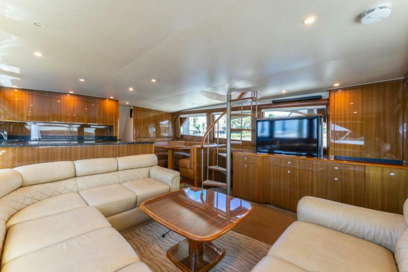 a living room with a large tv aboard SALT STRUK Yacht for Sale