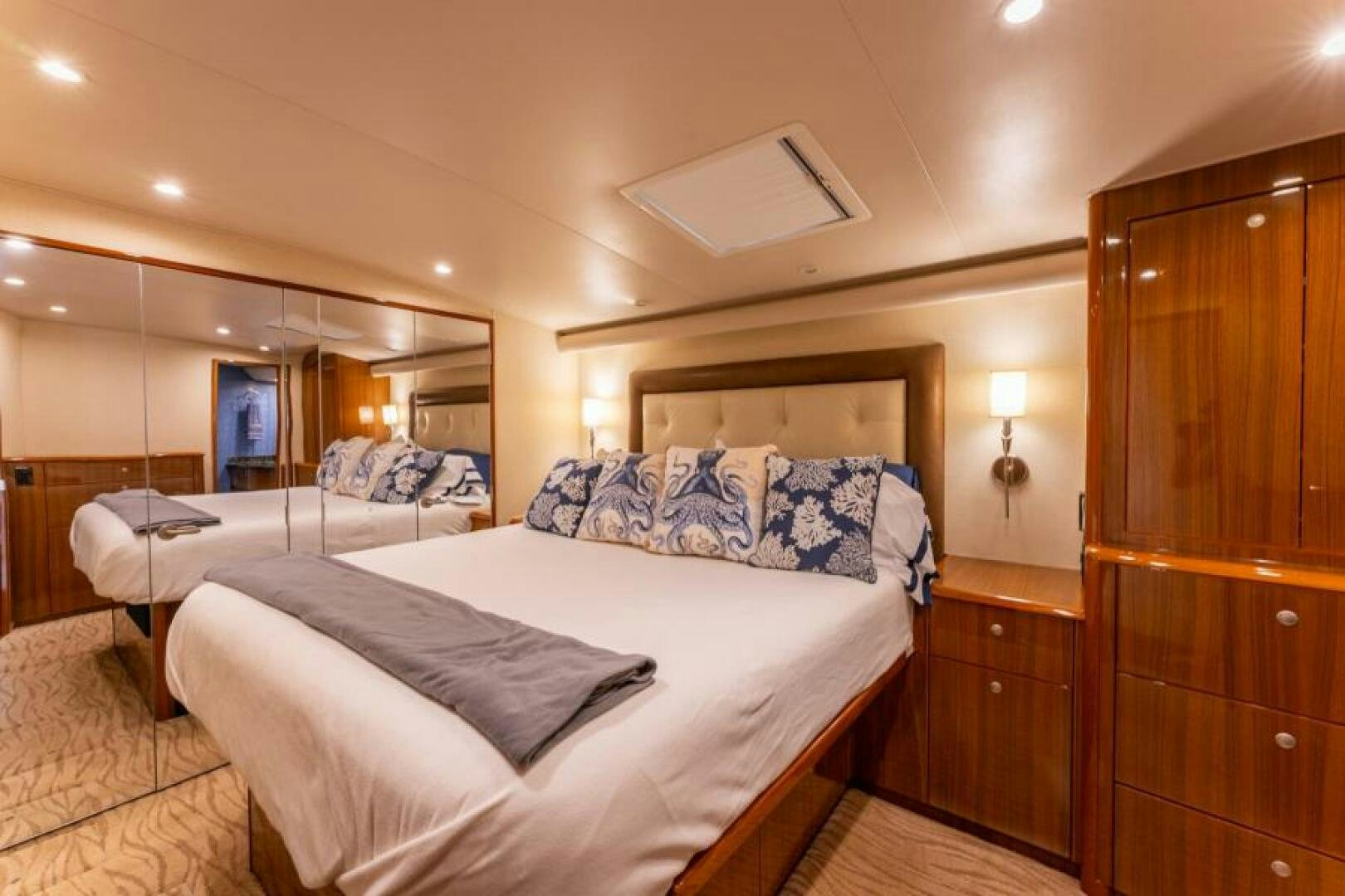 a room with a bed and a closet aboard SALT STRUK Yacht for Sale