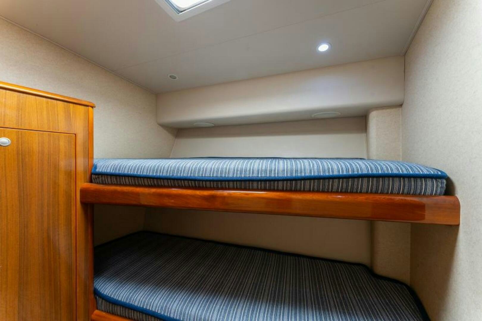 a wooden shelf with a blue mat aboard SALT STRUK Yacht for Sale