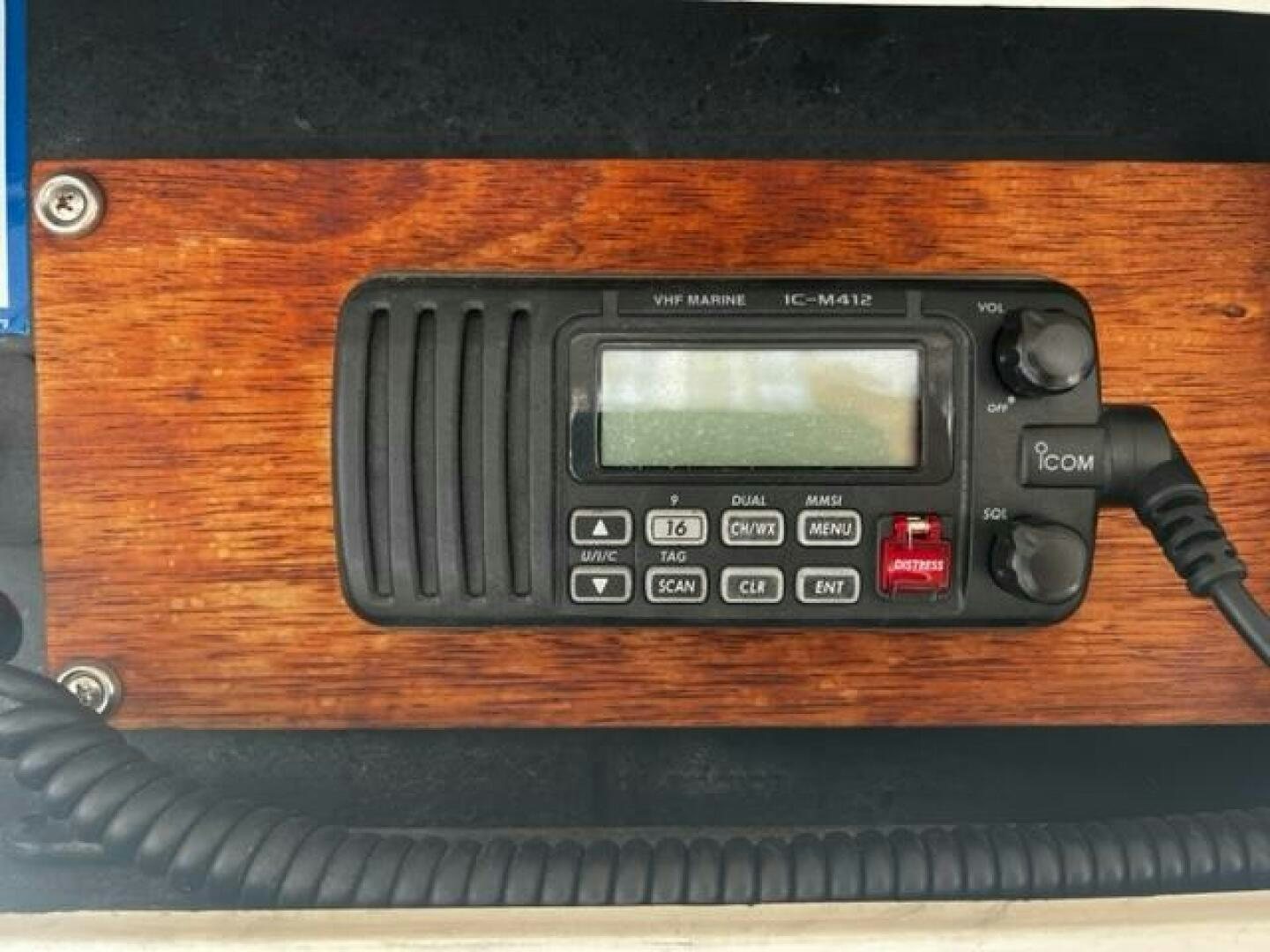 a black telephone on a wooden surface aboard GREAT WHITE Yacht for Sale