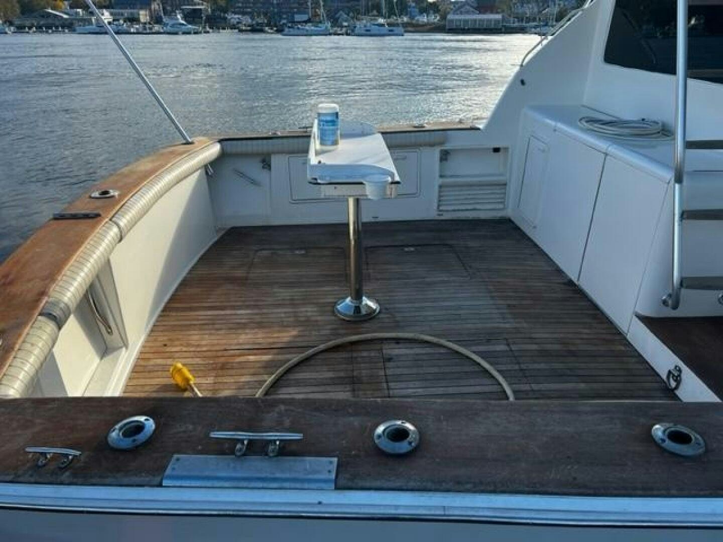 a wooden deck with a sink and a large white object on it aboard GREAT WHITE Yacht for Sale