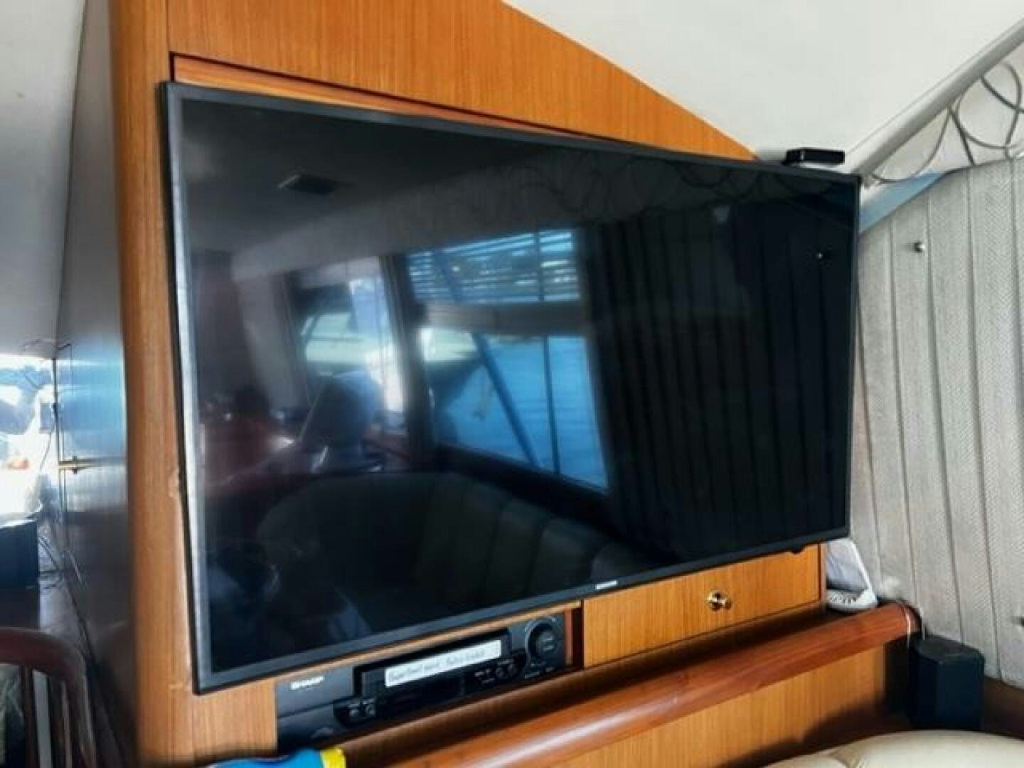a tv on a stand aboard GREAT WHITE Yacht for Sale