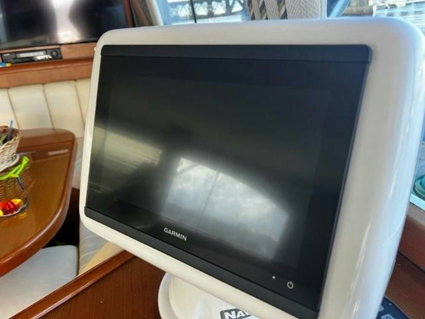 a black television on a stand aboard GREAT WHITE Yacht for Sale