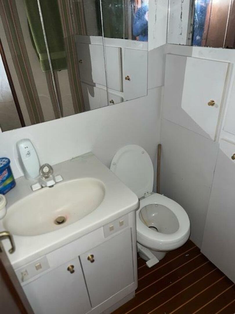 a bathroom with a sink and toilet aboard GREAT WHITE Yacht for Sale