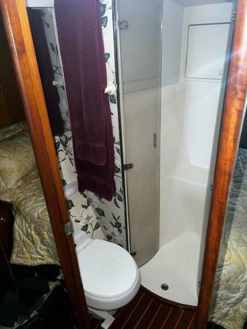 a bathroom with a pink towel on the wall aboard GREAT WHITE Yacht for Sale