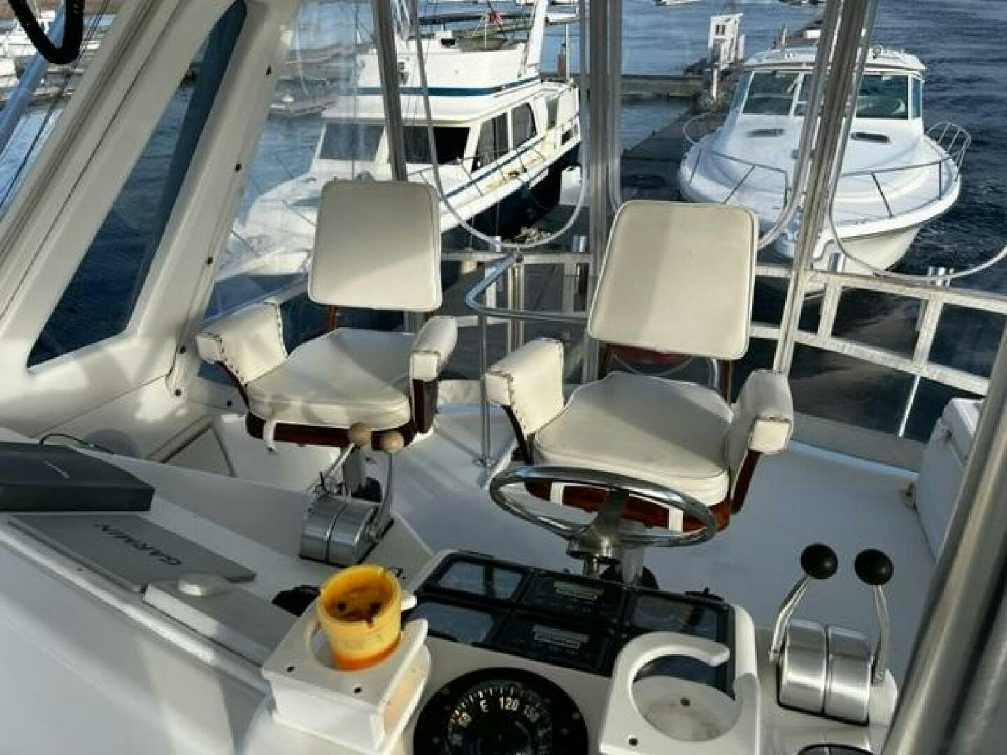 a boat with a chair on the deck aboard GREAT WHITE Yacht for Sale