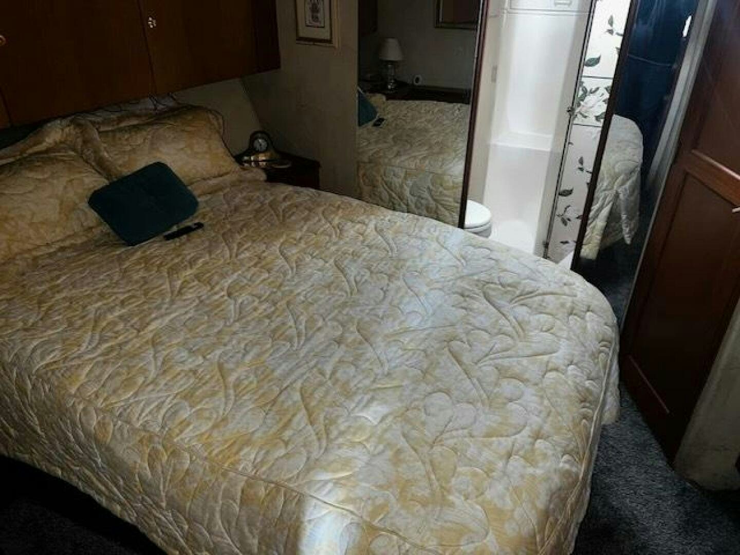 a laptop on a bed aboard GREAT WHITE Yacht for Sale