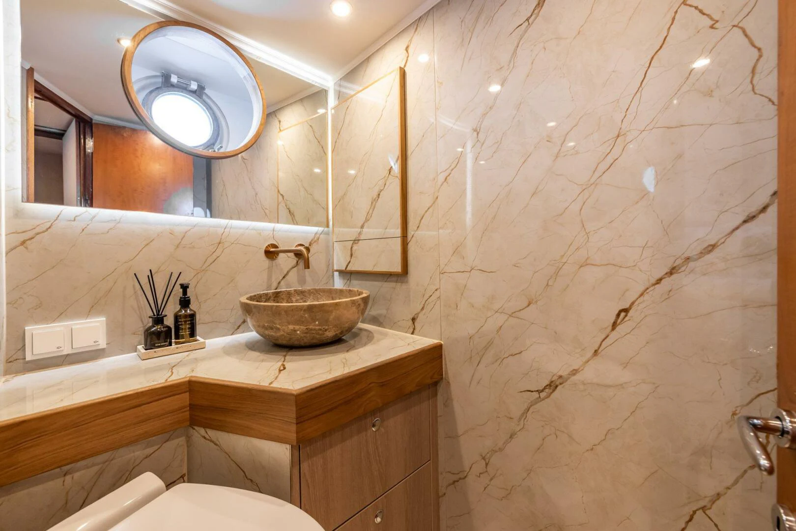 a bathroom with a large mirror aboard SISSI Yacht for Sale
