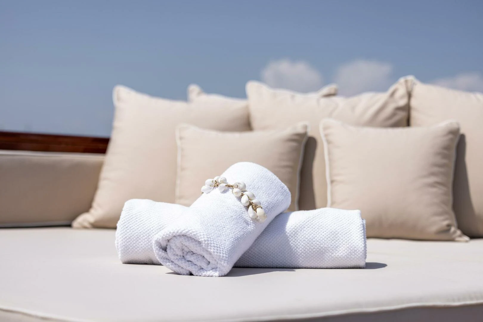 a white pillow on a bed with Walt Disney Concert Hall in the background aboard SISSI Yacht for Sale