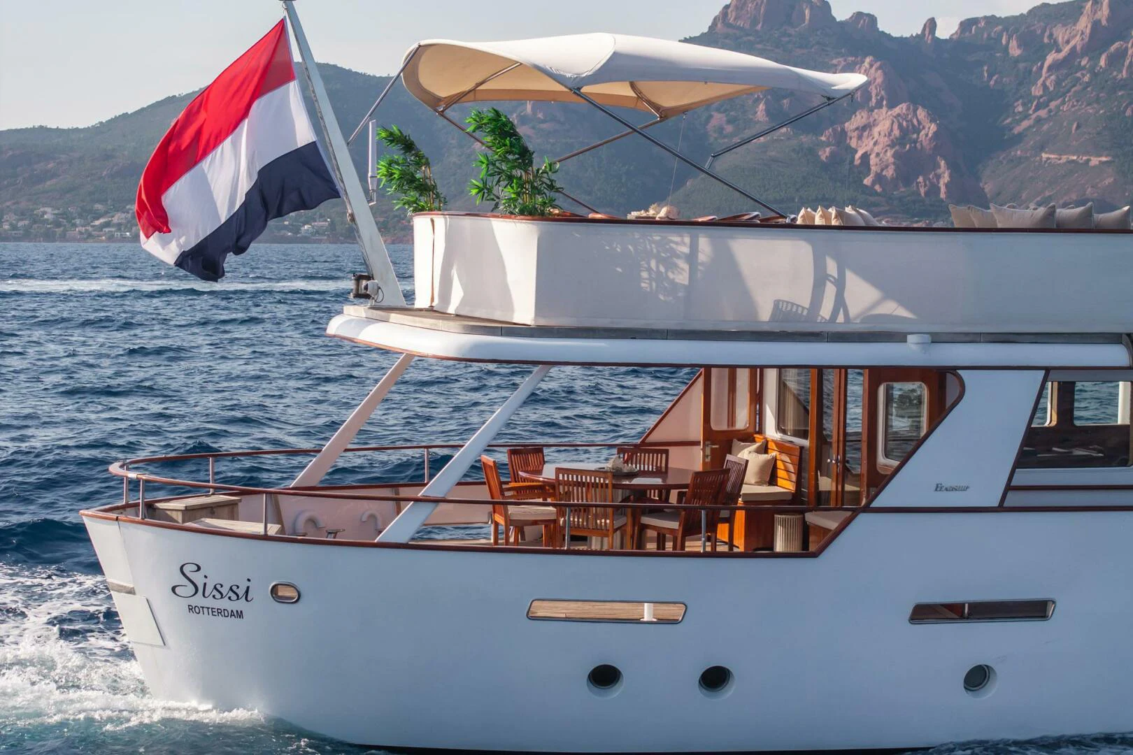 a boat with a flag on the front aboard SISSI Yacht for Sale