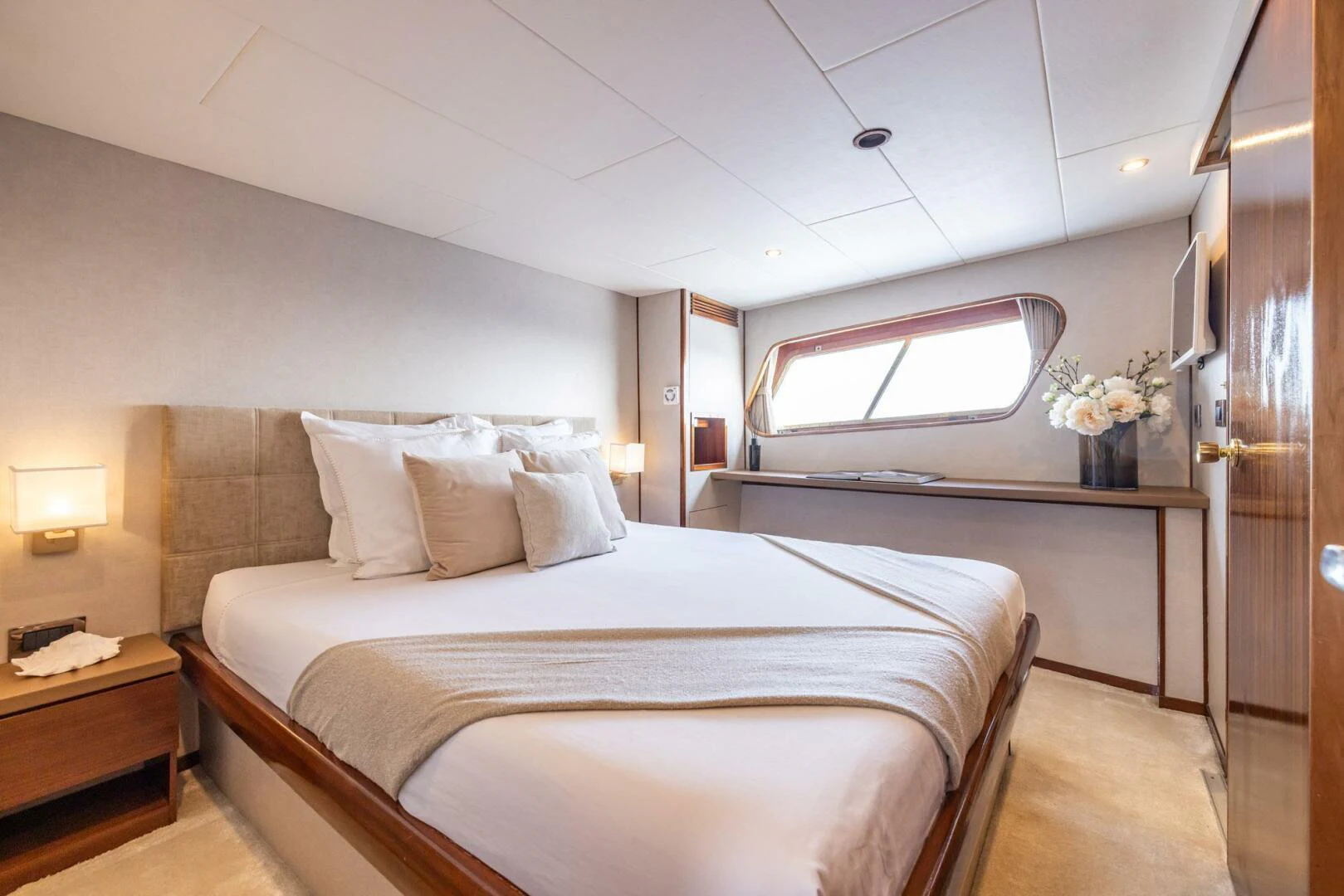 a bed with white sheets aboard SISSI Yacht for Sale