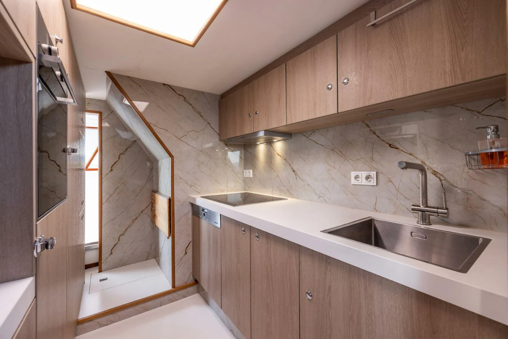 a kitchen with a sink and cabinets aboard SISSI Yacht for Sale