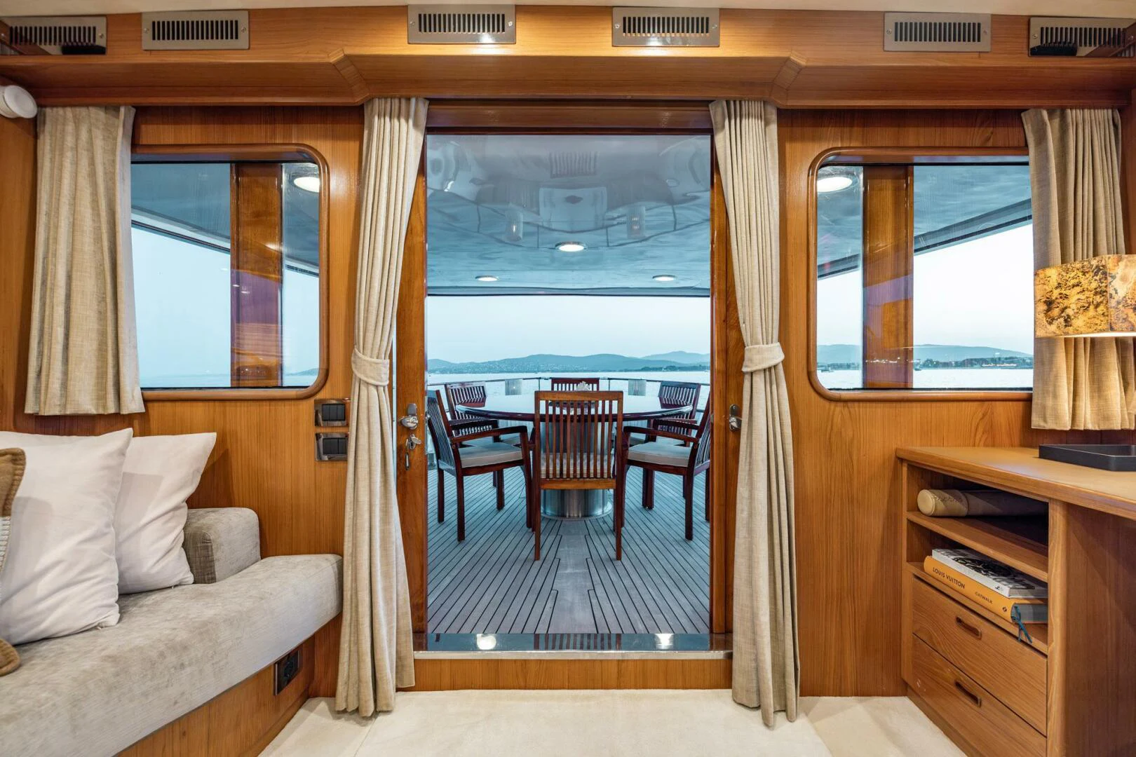 a room with a couch and a table and a window aboard SISSI Yacht for Sale