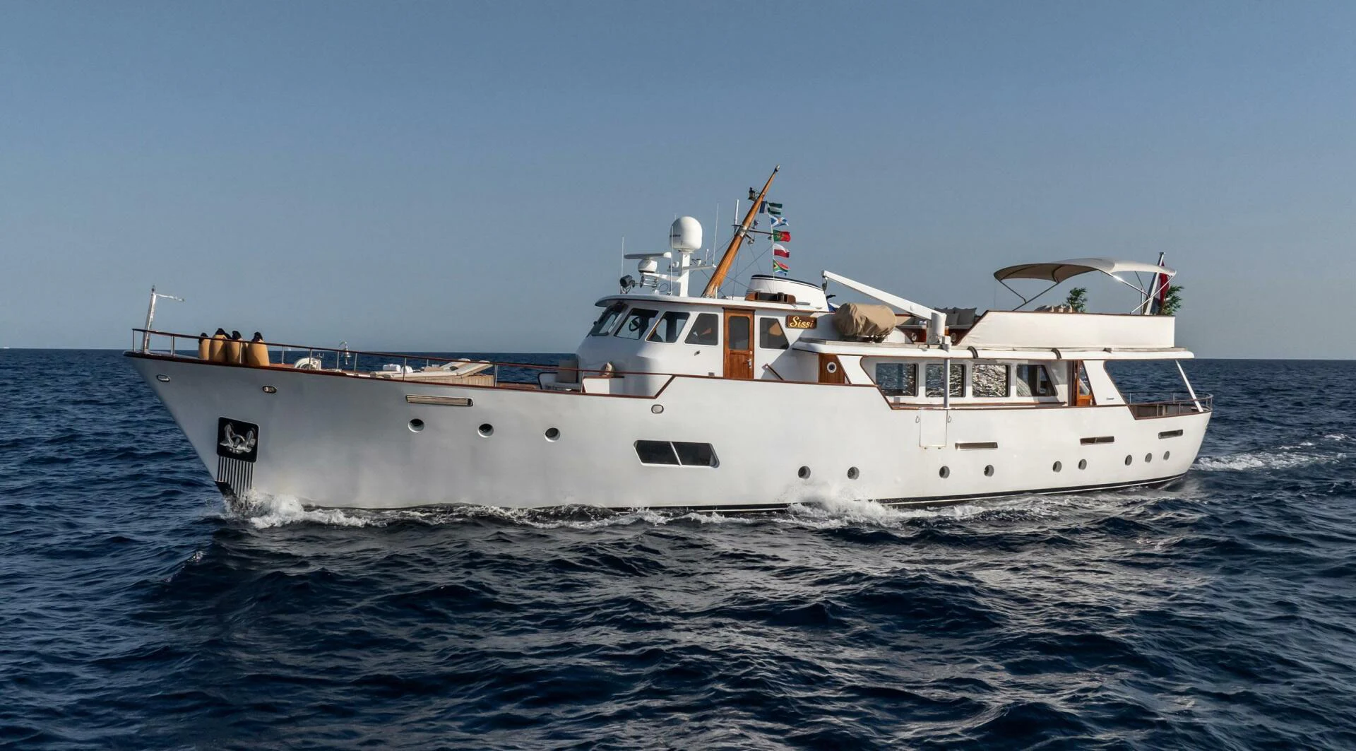a large white boat in the water aboard SISSI Yacht for Sale