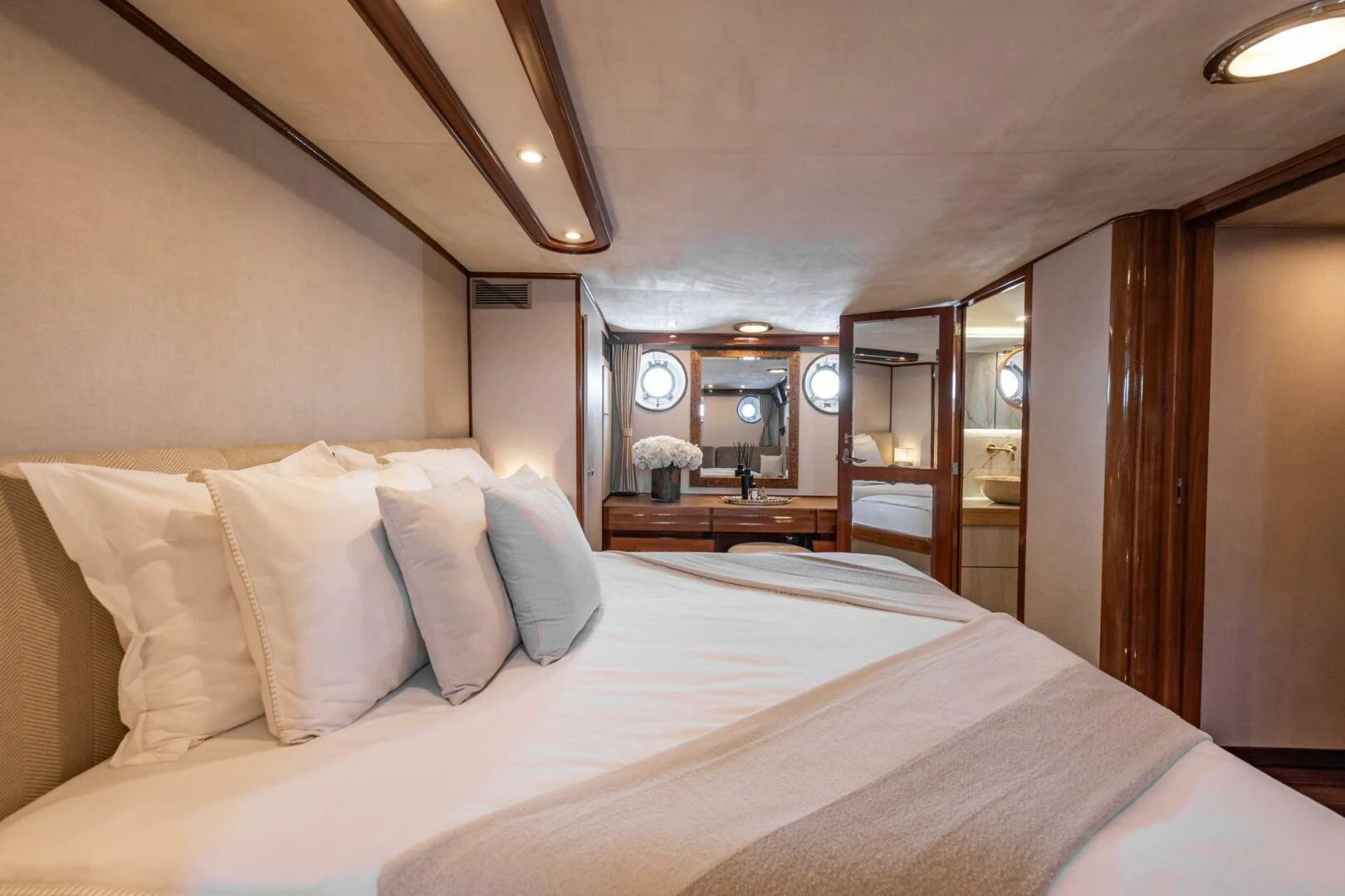 a bed with white sheets aboard SISSI Yacht for Sale