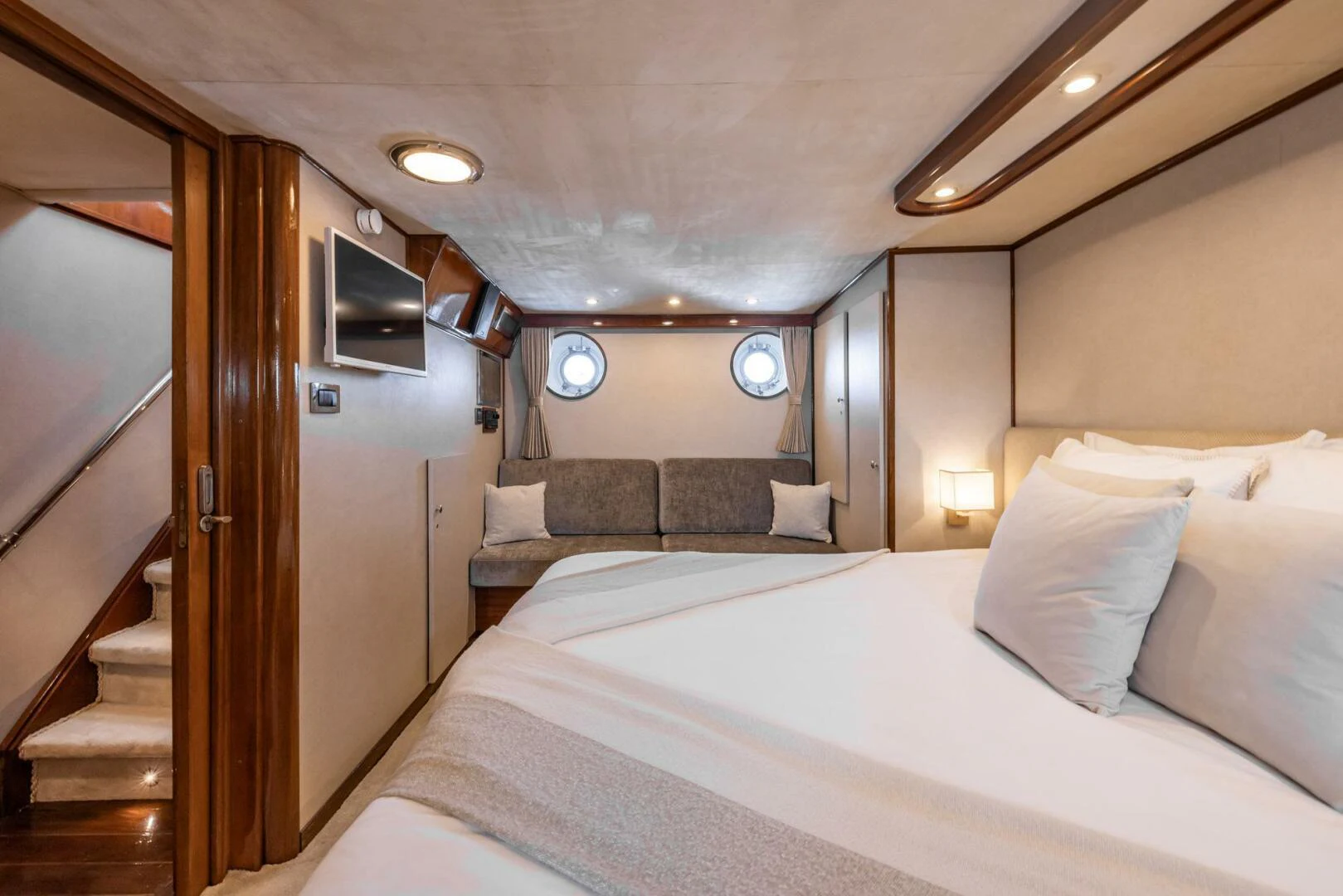 a room with a bed and a couch aboard SISSI Yacht for Sale