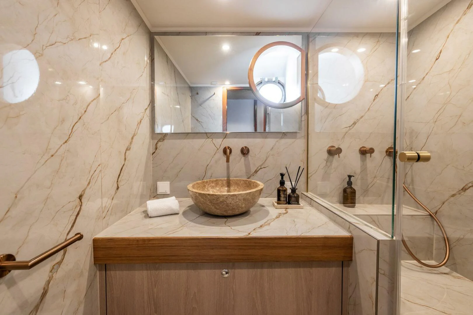 a bathroom with a sink and a mirror aboard SISSI Yacht for Sale