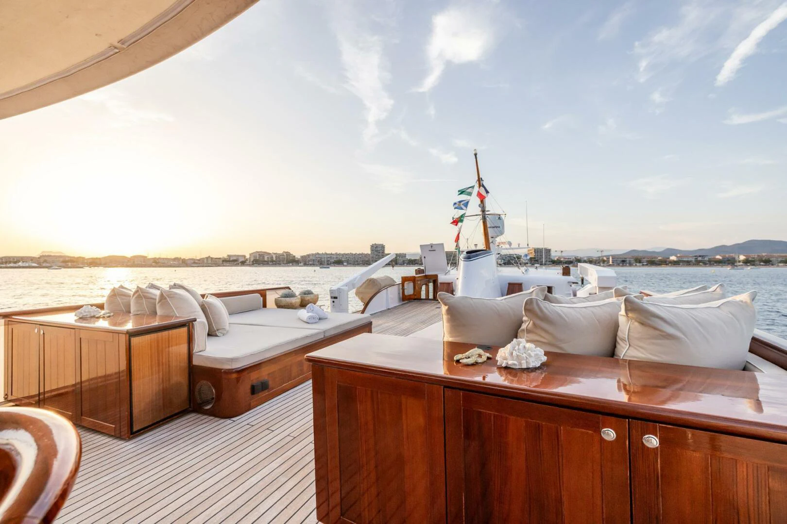 a room with a view of the ocean and a large boat aboard SISSI Yacht for Sale
