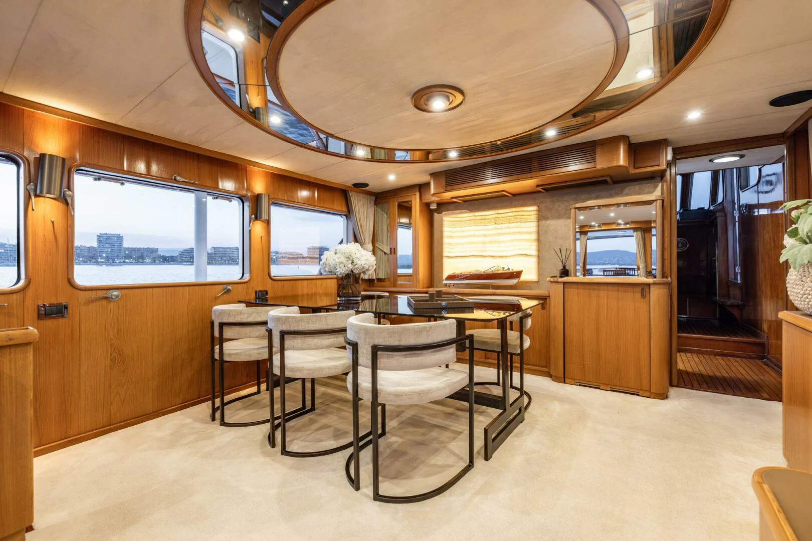 a room with a table and chairs aboard SISSI Yacht for Sale