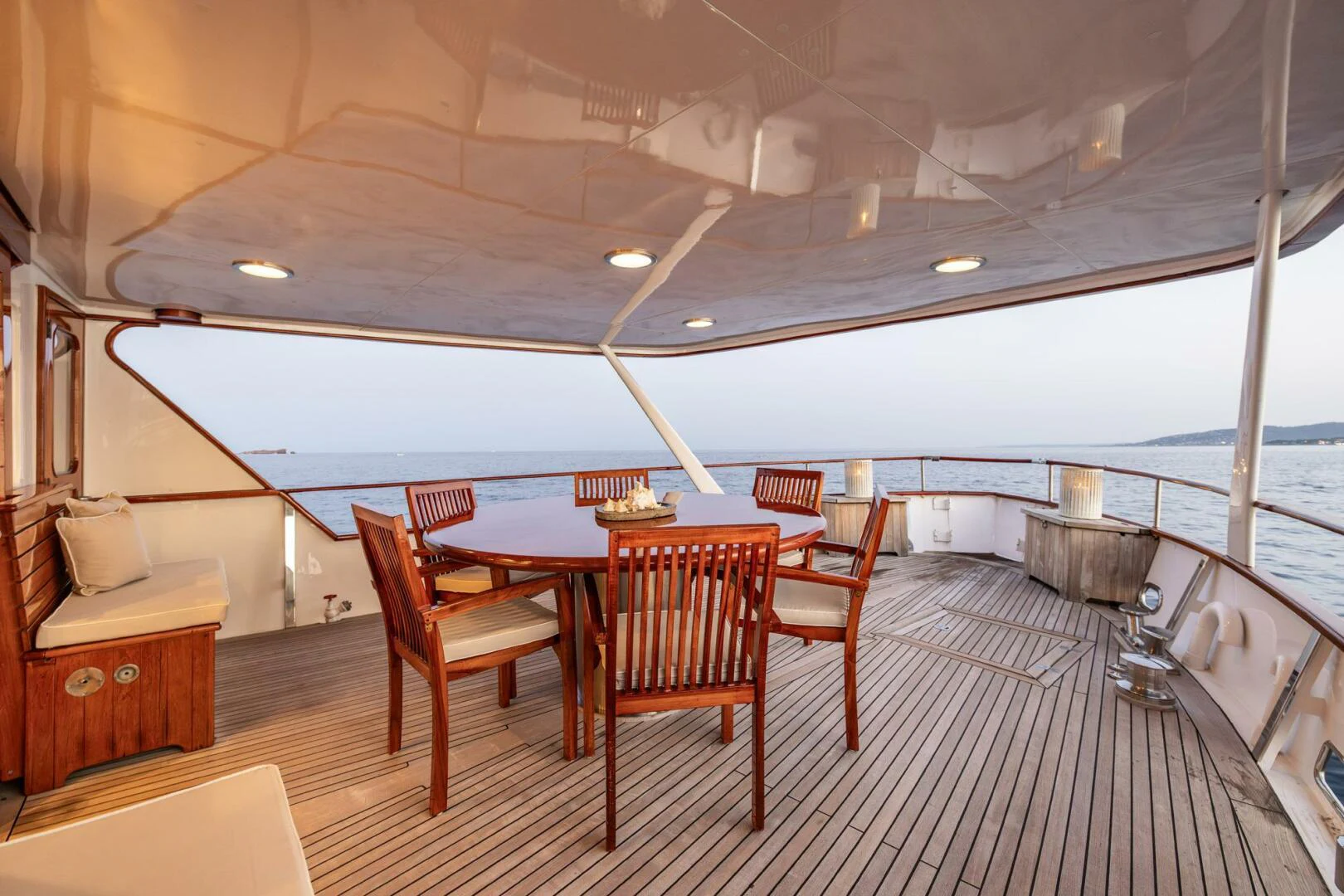 a large room with a table and chairs aboard SISSI Yacht for Sale