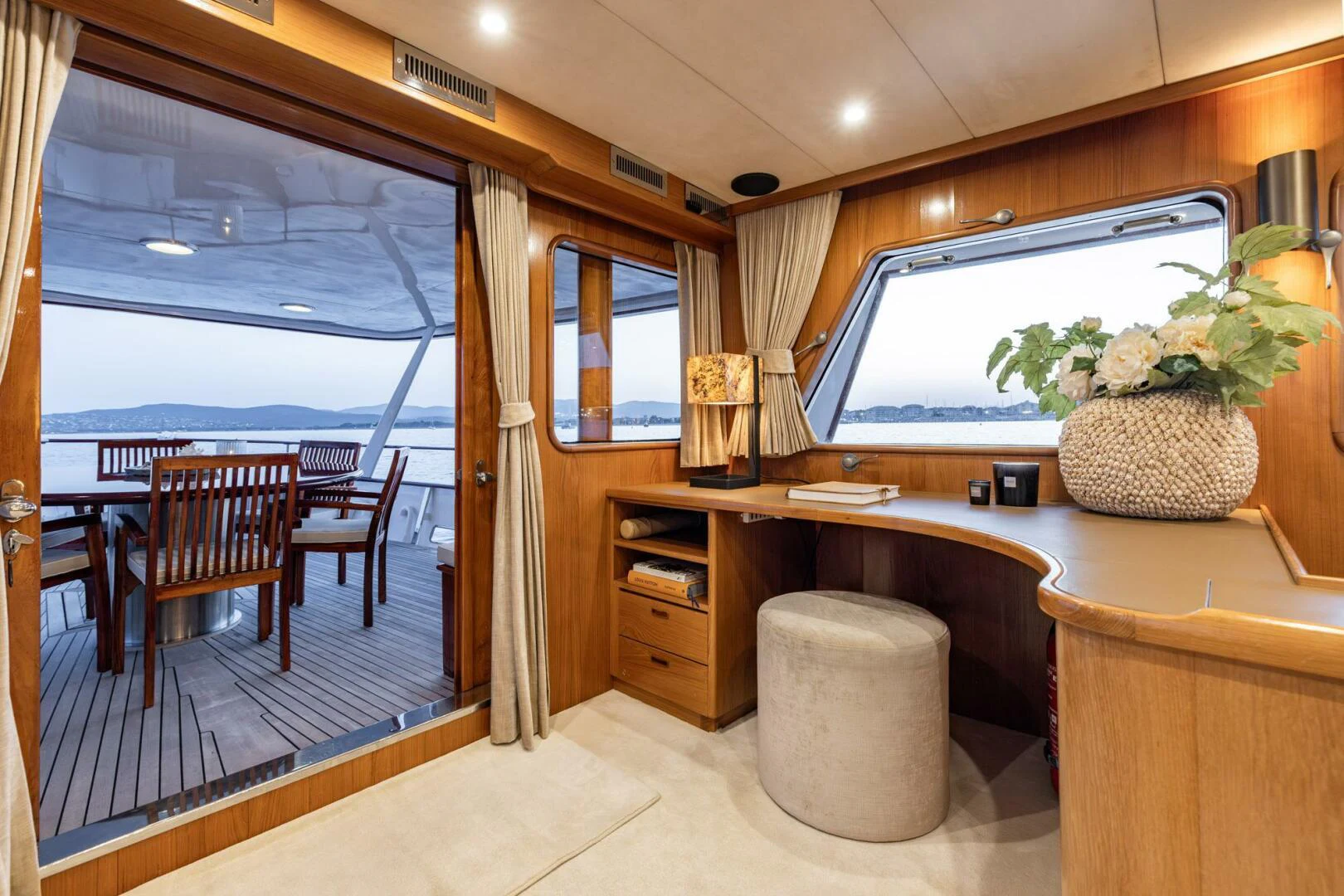 a room with a desk and a large window aboard SISSI Yacht for Sale