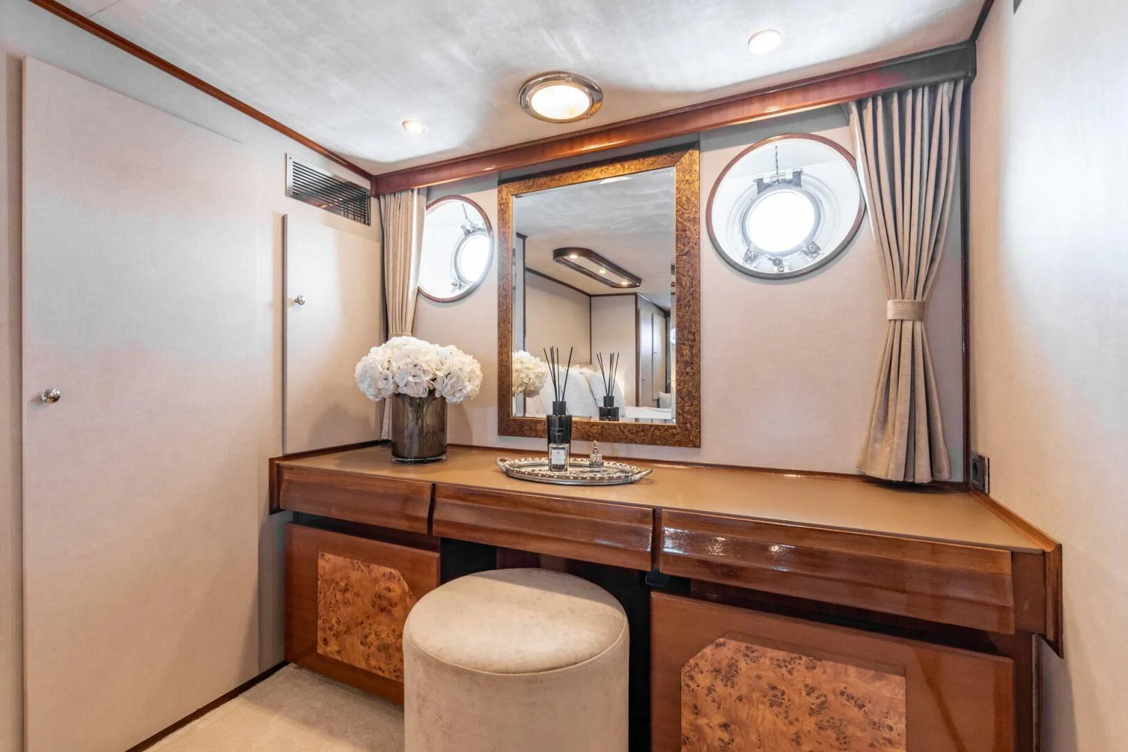 a bathroom with a vanity and mirrors aboard SISSI Yacht for Sale