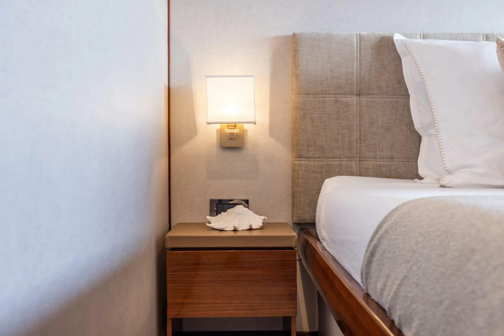 a hotel room with a bed and a lamp aboard SISSI Yacht for Sale