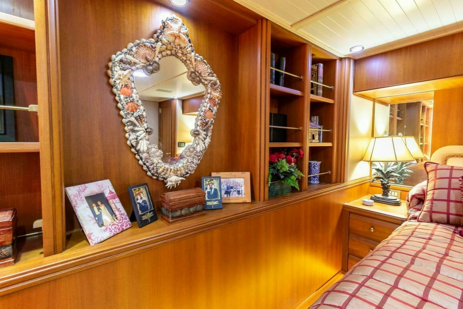 a room with a mirror and a bed aboard CHAIRMAN  Yacht for Sale