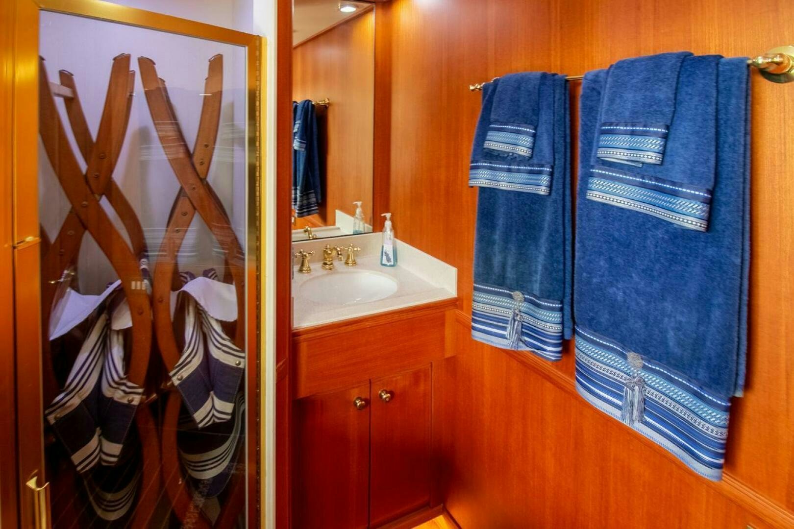 a bathroom with a towel on the wall aboard CHAIRMAN  Yacht for Sale