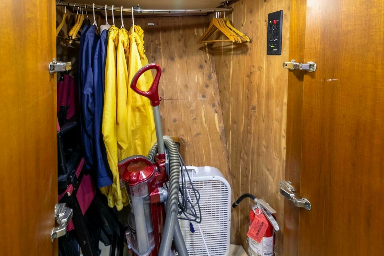 a closet with clothes and items aboard CHAIRMAN  Yacht for Sale