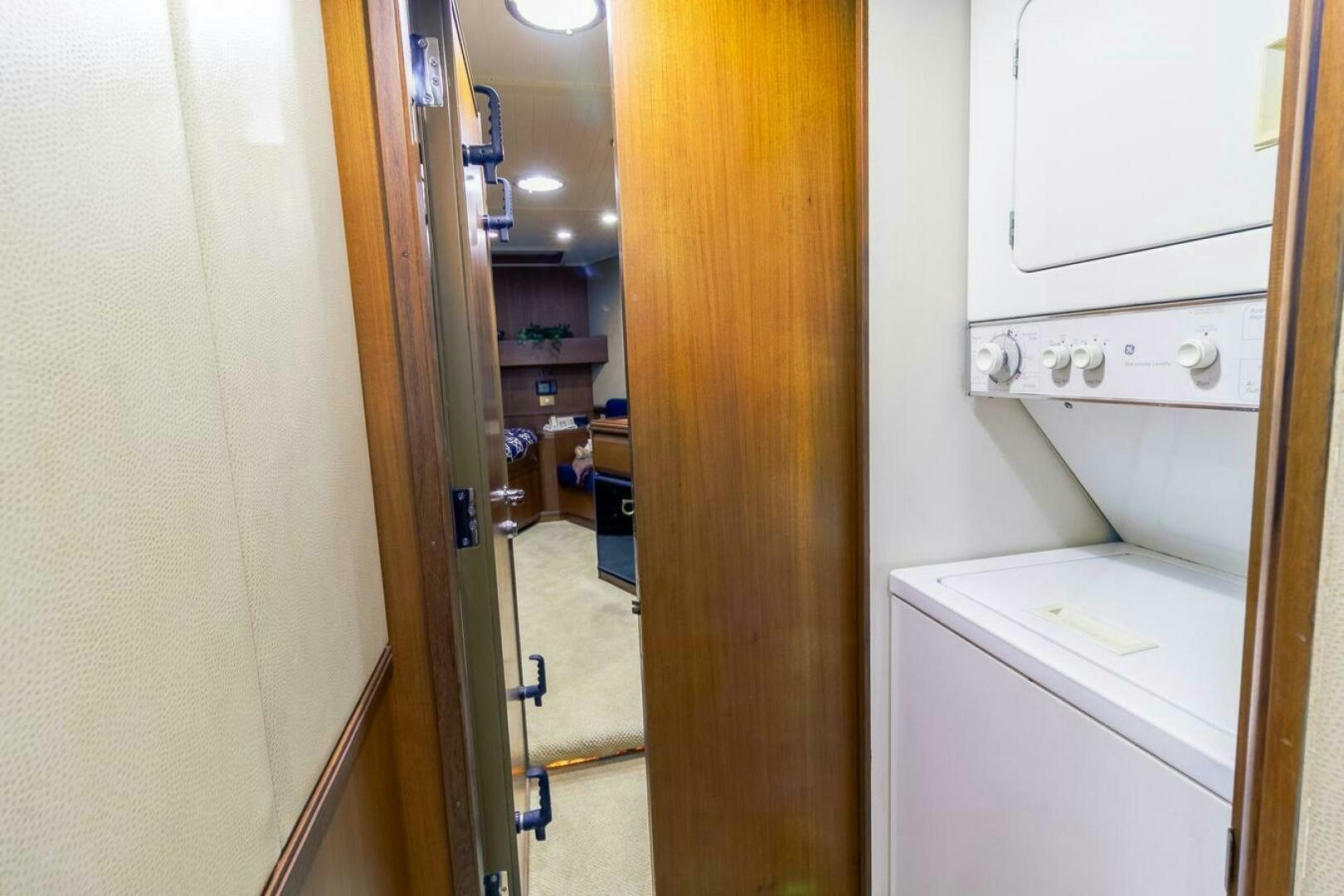 a room with a washing machine and dryer aboard CHAIRMAN  Yacht for Sale