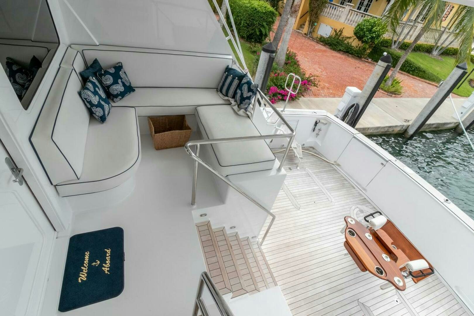 a balcony with a chair and a table and chairs on it aboard CHAIRMAN  Yacht for Sale