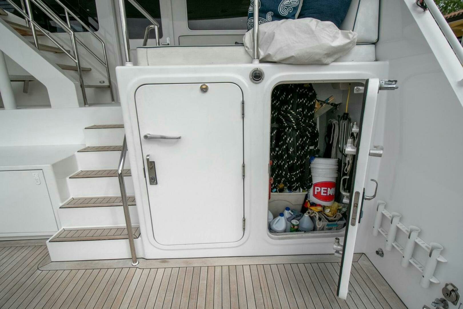 a white cabinet with a door open aboard CHAIRMAN  Yacht for Sale
