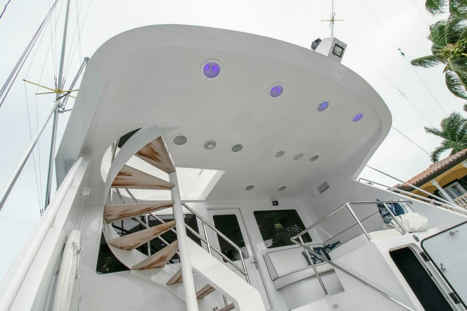 a white building with a spiral staircase aboard CHAIRMAN  Yacht for Sale