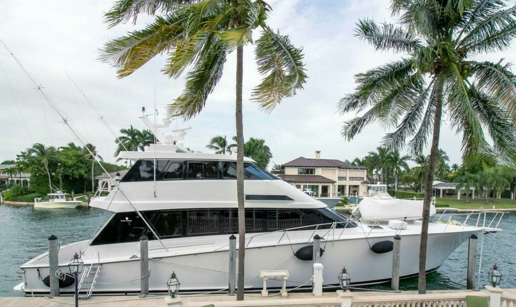 a white boat on a dock aboard CHAIRMAN  Yacht for Sale