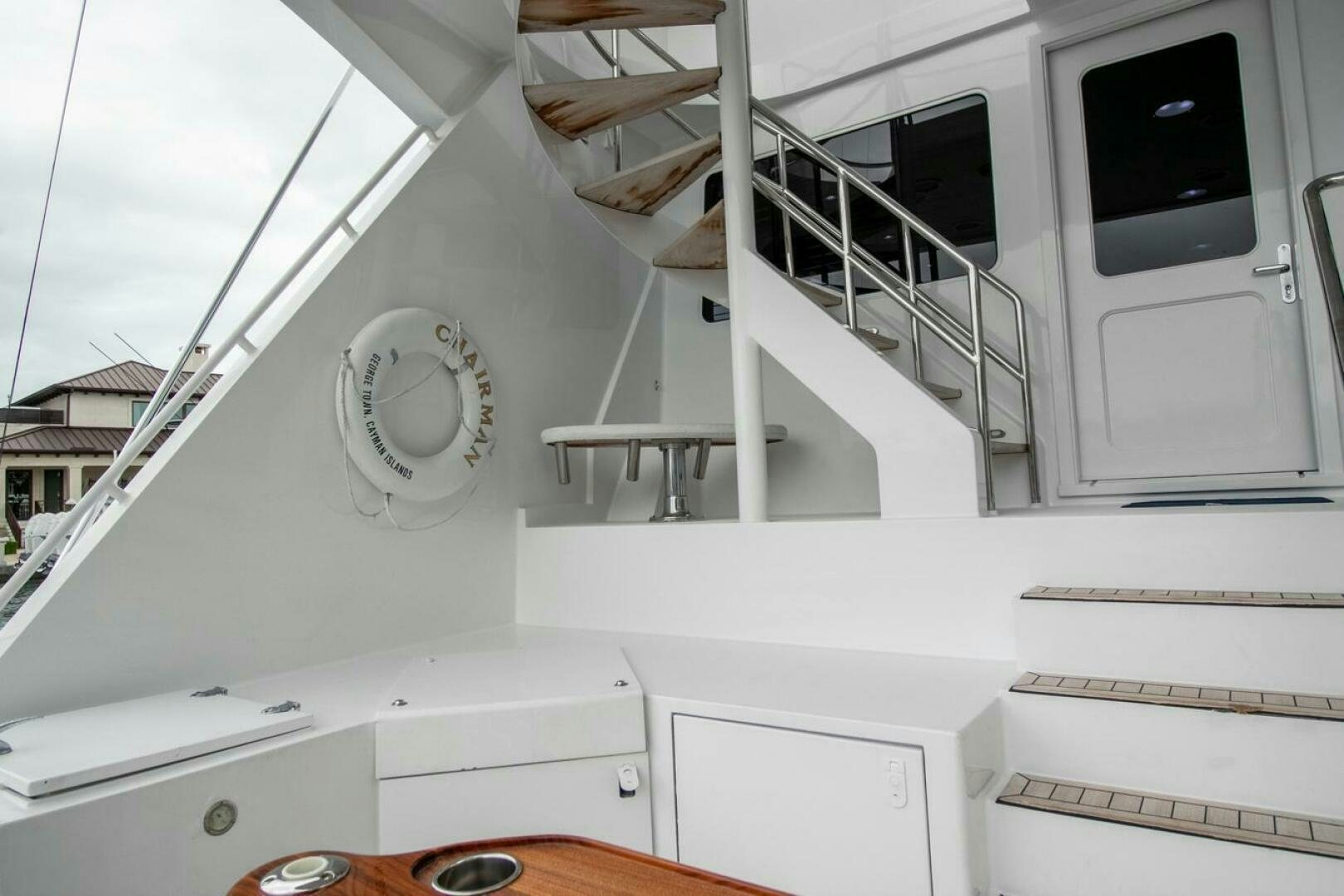 a white house with a staircase aboard CHAIRMAN  Yacht for Sale