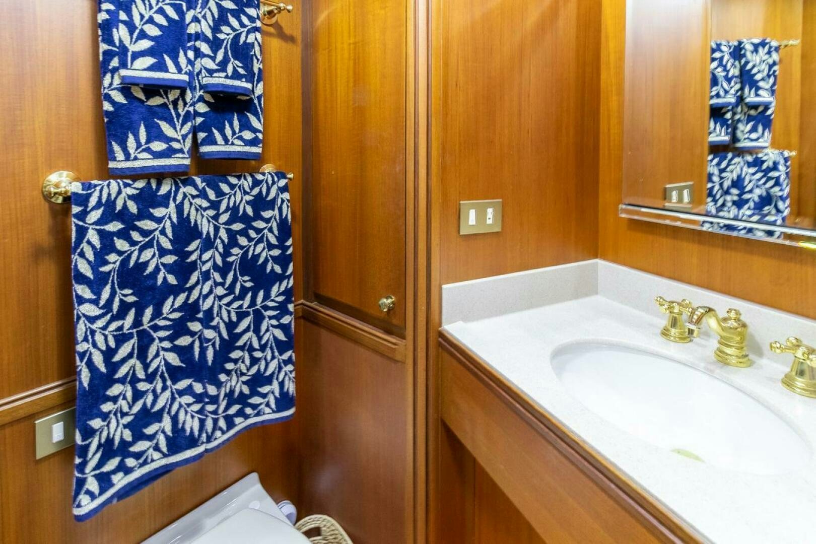 a bathroom with a sink and a mirror aboard CHAIRMAN  Yacht for Sale