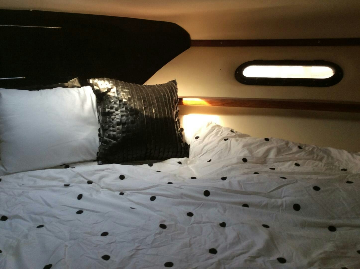 a bed with white sheets aboard TREES HOUSE Yacht for Sale