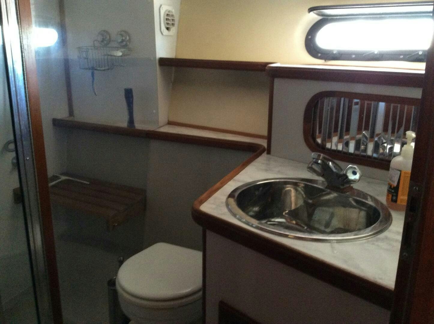 a bathroom with a sink and toilet aboard TREES HOUSE Yacht for Sale