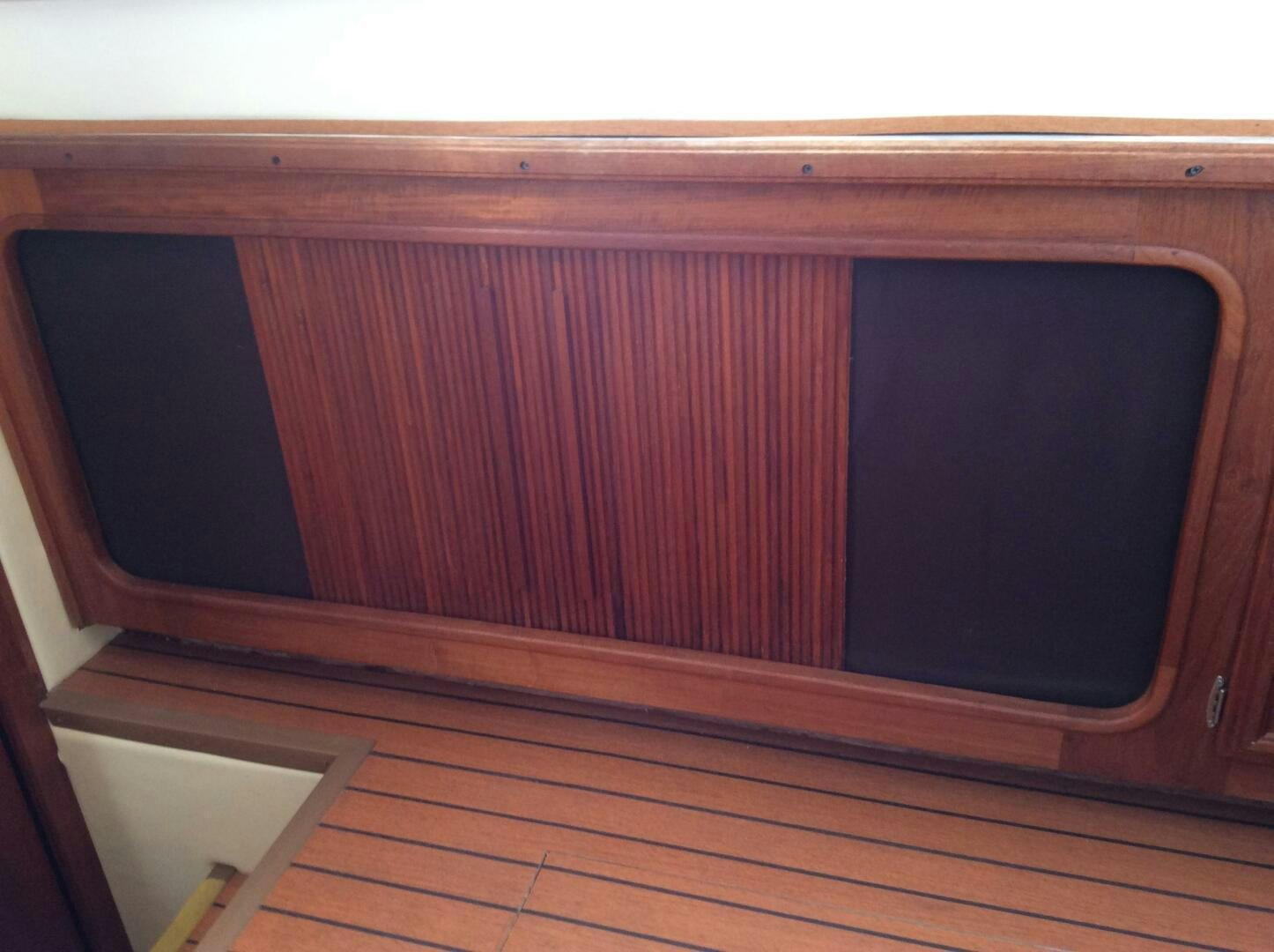 a red curtain with a white frame aboard TREES HOUSE Yacht for Sale