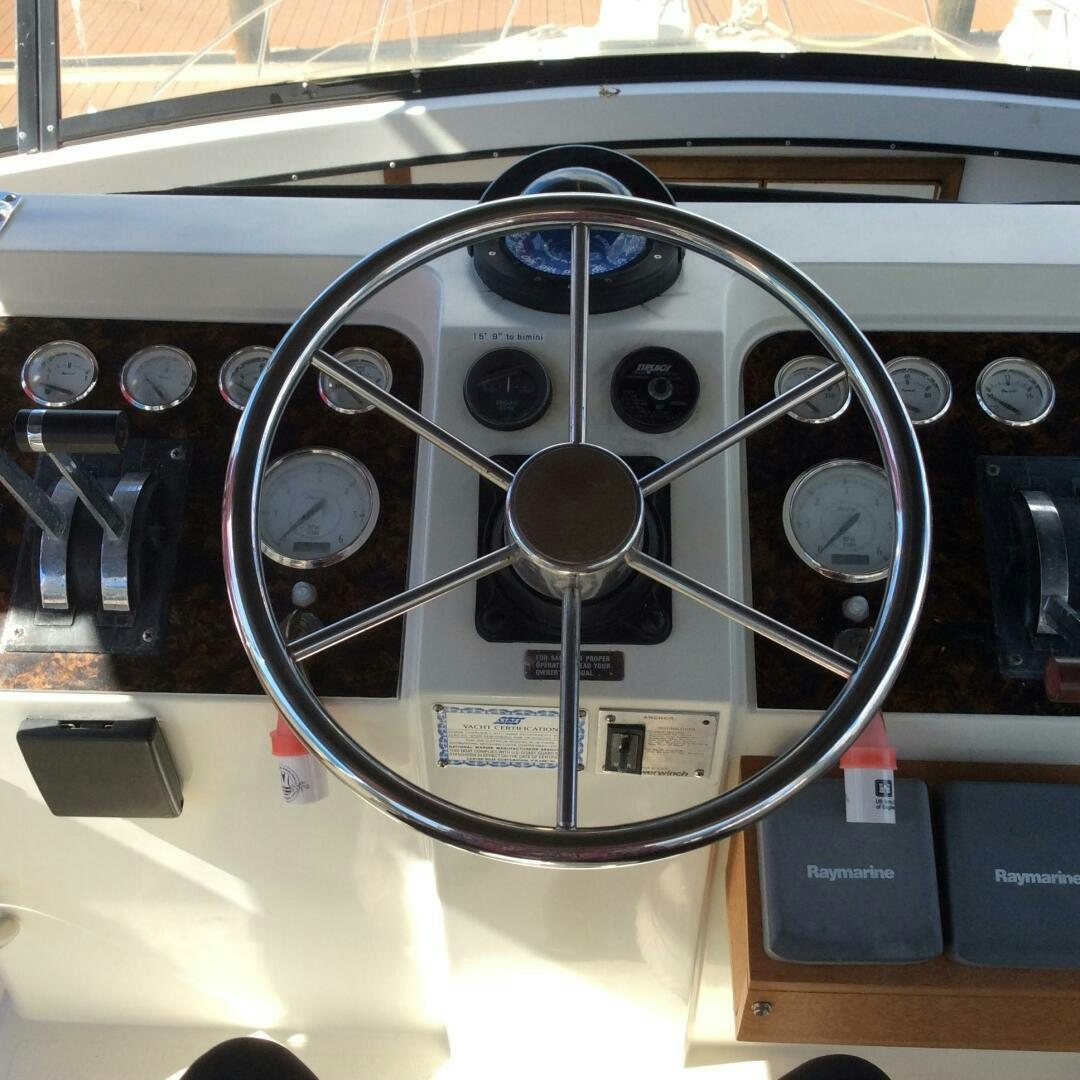 a close-up of a steering wheel aboard TREES HOUSE Yacht for Sale
