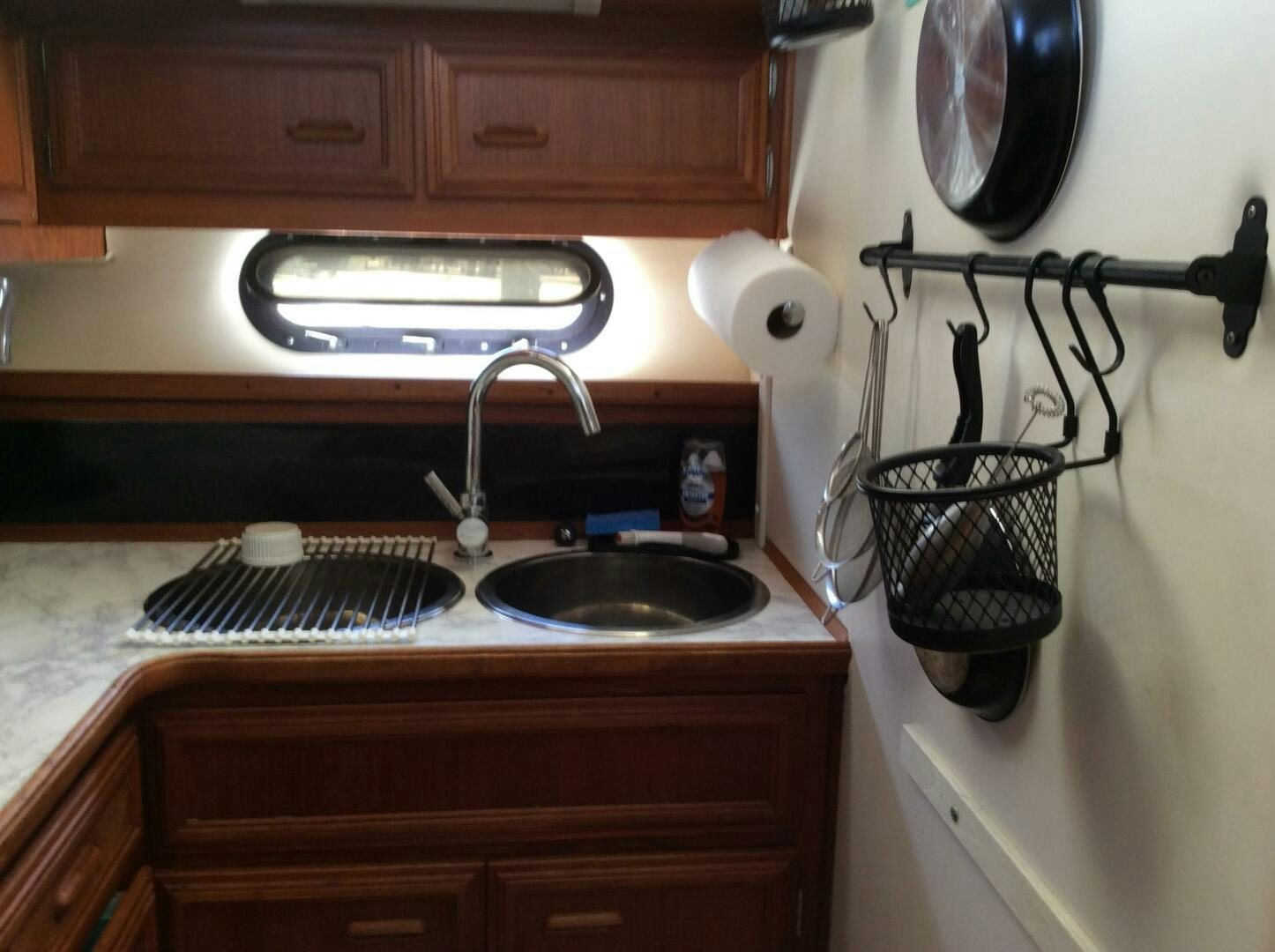 a kitchen with a sink and a stove aboard TREES HOUSE Yacht for Sale