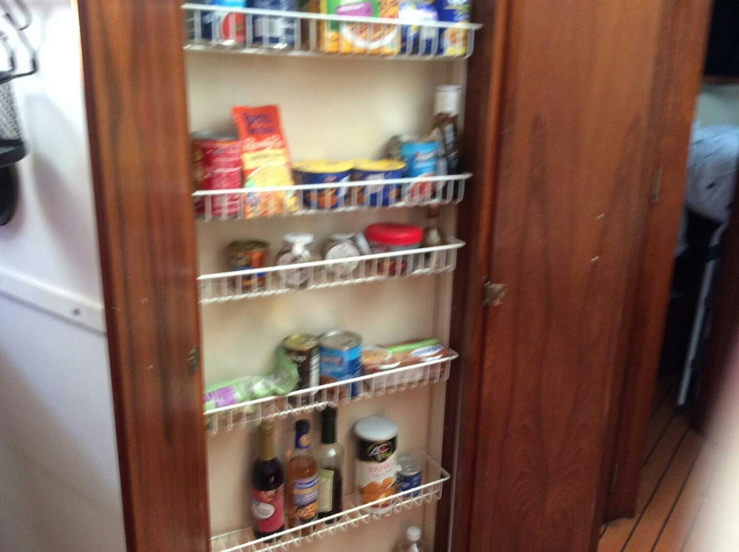 a refrigerator with food and drinks aboard TREES HOUSE Yacht for Sale